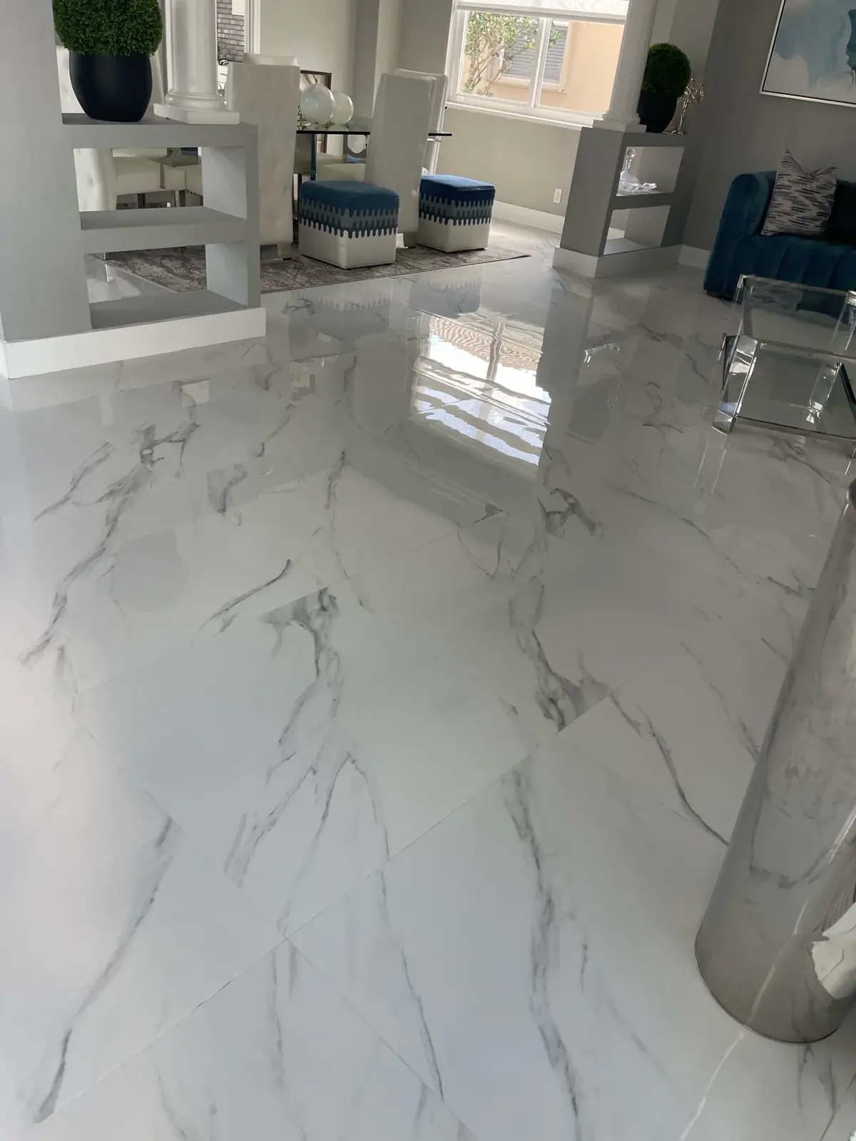 Reflective porcelain tile floor after professional Steamly Pro floor care